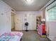 Cozy bedroom with lilac walls, carpet floors, and a window that provides natural light at 110 Dutch Creek Rd, Rockwell, NC 28138