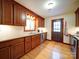 Well-lit kitchen featuring wooden cabinets, granite countertops, stainless steel appliances, and hardwood flooring at 110 Dutch Creek Rd, Rockwell, NC 28138
