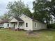 Classic single-story house featuring a covered porch and a spacious yard at 110 E Church St, Dallas, NC 28034