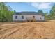 Exterior view showcasing the back of the home with a walkout basement at 1119 Stanback Rd, Chester, SC 29730