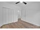 Bedroom with laminate floors, a fan, and large closet space at 1119 Stanback Rd, Chester, SC 29730