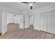 Open bedroom featuring laminate floors, a fan, and closet space at 1119 Stanback Rd, Chester, SC 29730