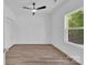 Bright bedroom featuring laminate floors, a fan, a closet, and a window at 1119 Stanback Rd, Chester, SC 29730