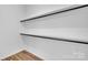 Empty closet with shelves and black rods for hanging clothes at 1119 Stanback Rd, Chester, SC 29730