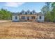 Charming one-story home with board and batten siding and a welcoming porch at 1119 Stanback Rd, Chester, SC 29730