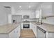 Well-equipped kitchen with granite countertops, stainless appliances, and wood-look floors at 1119 Stanback Rd, Chester, SC 29730
