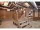 Basement featuring exposed brick walls, wooden staircase, and exposed ceiling at 122 Corban Se Ave, Concord, NC 28025