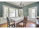 Bright dining room with large windows, hardwood floors, and elegant chandelier at 122 Corban Se Ave, Concord, NC 28025