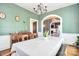 Charming dining room with hardwood floors, chandelier, and adjacent living area at 122 Corban Se Ave, Concord, NC 28025