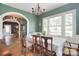 Elegant dining room with hardwood floors, large windows, and an open view to the living area at 122 Corban Se Ave, Concord, NC 28025
