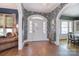 Inviting foyer with hardwood floors, elegant wallpaper, and a grand front door entrance at 122 Corban Se Ave, Concord, NC 28025