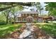 Charming brick home with manicured lawn and inviting stone walkway leading to the front entrance at 122 Corban Se Ave, Concord, NC 28025