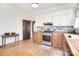 Kitchen with butcher block counters, a stainless steel range and painted tile backsplash at 122 Corban Se Ave, Concord, NC 28025