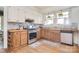 The kitchen offers white cabinets, butcher block countertops, and stainless steel appliances at 122 Corban Se Ave, Concord, NC 28025
