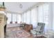 Comfortable living room with a window seat, and many windows to let natural light in at 122 Corban Se Ave, Concord, NC 28025