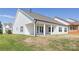 Home exterior showcases a well-manicured lawn and pristine white siding at 13063 Arnold Palmer Cir # 839, Lancaster, SC 29720