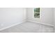 Bright bedroom with a window offering natural light and neutral carpeting at 13063 Arnold Palmer Cir # 839, Lancaster, SC 29720