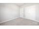 Bedroom featuring neutral carpeting and closets for ample storage at 13063 Arnold Palmer Cir # 839, Lancaster, SC 29720