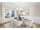 Bright dining area showcasing a modern glass table, designer chairs, and stylish light fixture at 13063 Arnold Palmer Cir # 839, Lancaster, SC 29720