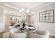Bright dining room featuring a glass table, chandelier, and elegant decor at 13063 Arnold Palmer Cir # 839, Lancaster, SC 29720