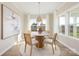 Cozy dining room with a round table, large windows, and stylish decor at 13063 Arnold Palmer Cir # 839, Lancaster, SC 29720