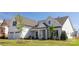 Attractive home showcasing manicured landscaping, a covered porch, and a two-car garage at 13063 Arnold Palmer Cir # 839, Lancaster, SC 29720