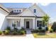 Inviting front entrance with manicured landscaping and an elegant covered porch at 13063 Arnold Palmer Cir # 839, Lancaster, SC 29720