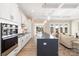 Bright kitchen featuring modern appliances, a central island, and an open layout connecting to living spaces at 13063 Arnold Palmer Cir # 839, Lancaster, SC 29720