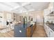 Open concept kitchen with island, seamlessly connected to the living room and dining area at 13063 Arnold Palmer Cir # 839, Lancaster, SC 29720