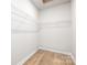 Empty walk-in closet, ready for organization at 13063 Arnold Palmer Cir # 839, Lancaster, SC 29720
