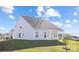 Exterior view of home highlighting the backyard and the covered porch at 13279 Arnold Palmer Cir # 867, Lancaster, SC 29720