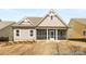 Charming backyard with a covered porch and a well-maintained lawn at 13279 Arnold Palmer Cir # 867, Lancaster, SC 29720