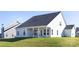 Well-maintained backyard features lush grass and a covered back porch at 13279 Arnold Palmer Cir # 867, Lancaster, SC 29720