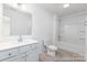 Well-lit bathroom with white vanity, modern fixtures, and a combined shower-tub at 13279 Arnold Palmer Cir # 867, Lancaster, SC 29720