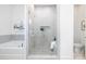 Luxurious bathroom featuring a glass-enclosed shower, soaking tub, and elegant tile work at 13279 Arnold Palmer Cir # 867, Lancaster, SC 29720