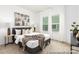 Bright bedroom featuring a large window, neutral decor, and contemporary furnishings at 13279 Arnold Palmer Cir # 867, Lancaster, SC 29720