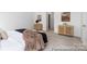 Cozy bedroom with natural light featuring neutral decor, plush carpet, and ample closet space at 13279 Arnold Palmer Cir # 867, Lancaster, SC 29720