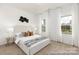 Bright bedroom with natural light and neutral decor, featuring modern art and cozy furniture at 13279 Arnold Palmer Cir # 867, Lancaster, SC 29720