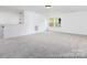Large bonus room featuring a modern light fixture and bright windows at 13279 Arnold Palmer Cir # 867, Lancaster, SC 29720