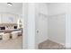 Walk-in closet off the main bedroom providing ample storage, with a bed in view at 13279 Arnold Palmer Cir # 867, Lancaster, SC 29720