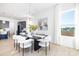 Airy dining space featuring a modern table, comfortable seating, and large windows at 13279 Arnold Palmer Cir # 867, Lancaster, SC 29720