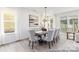 Elegant dining area with chandelier and access to the outdoor patio at 13279 Arnold Palmer Cir # 867, Lancaster, SC 29720