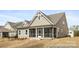 Exterior view of a home with a screened-in porch at 13279 Arnold Palmer Cir # 867, Lancaster, SC 29720