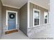 Close up of front entrance with welcoming wreath and craftsman style door at 13279 Arnold Palmer Cir # 867, Lancaster, SC 29720