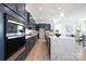 Elegant kitchen with a large center island, custom cabinetry, and stainless steel appliances at 13279 Arnold Palmer Cir # 867, Lancaster, SC 29720