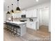 Bright kitchen featuring white cabinets, quartz countertops, and breakfast bar at 13279 Arnold Palmer Cir # 867, Lancaster, SC 29720