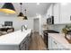 Kitchen with stainless steel appliances, island with sink, and wood flooring at 13279 Arnold Palmer Cir # 867, Lancaster, SC 29720