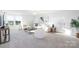 Well-lit living room with neutral carpet, a large window and stylish contemporary furnishings at 13279 Arnold Palmer Cir # 867, Lancaster, SC 29720