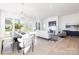 Bright, open-concept living room with dining area and modern fireplace featuring lots of natural light at 13279 Arnold Palmer Cir # 867, Lancaster, SC 29720