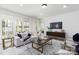 Cozy living room with neutral decor, stylish furniture, and sliding glass doors at 13279 Arnold Palmer Cir # 867, Lancaster, SC 29720